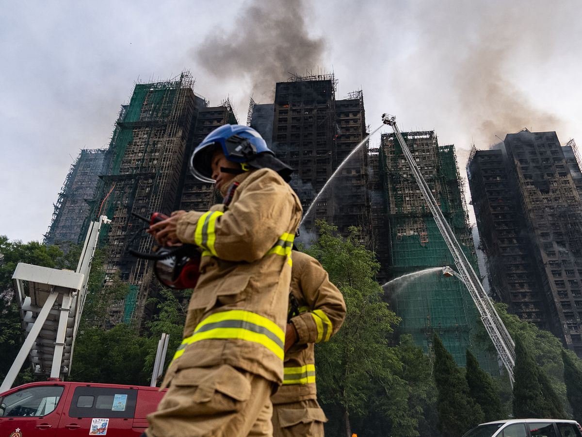 Firefighters continue to tackle deadly Hong Kong tower blaze