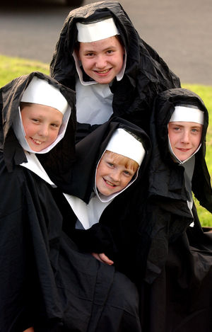 Michael Cooper, 11, Ashley Moore, 11, Nicholas Taylor, 13 and Ashley Price, 11 perform the musical Sister Act in 2004