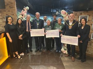 COSMO staff alongside representatives from each organisation presented with a cheque.