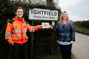 Sarah Garbett surprised her postman Dave Hart with a Thank You book from the local community