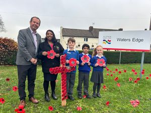 Children and teachers from Landywood Primary School [L-R] Rowan Perry, 9, Dev Chamdal 7, Lola Barton 6, with Headteacher Andrew Clewer and Teacher Hardeep Johal, visit Waters Edge Care Home
