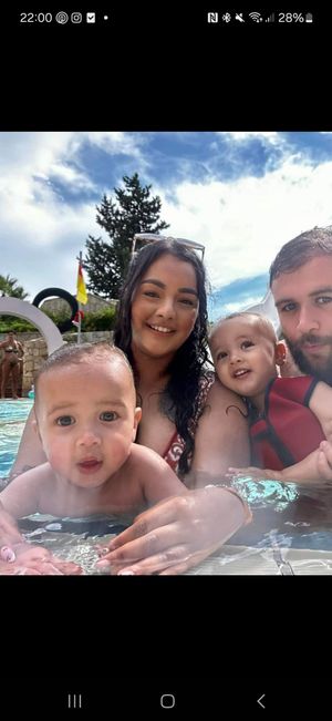 Ezra Barrett with parents Davina and Karl and brother Noah, aged two.