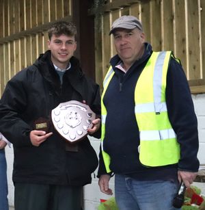 Andrew Ritchie presenting Nathan Davies with the best vintage tractor award