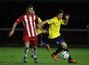 Sean Clancy of AFC Telford United and Brett Solkhon of Brackley Town