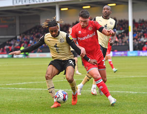 Walsall's Matty Stevens and Orient's Jayden Sweeney