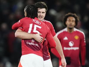 Manchester United’s Leny Yoro (left) and Harry Maguire celebrate (Nick Potts/PA)