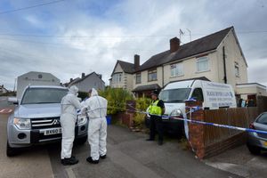 Police forensic teams at the scene