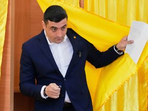 George Simion exits a voting booth