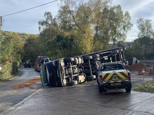 Supporting image for story: Lorry driver in hospital after HGV carrying sand rolls over