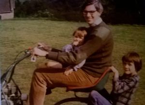 William Cash Jr, right, and his younger brother Sam, get a ride on the lawn mower with their father Bill in the 1970s