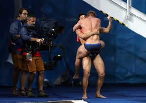 Jack Laugher and Chris Mears celebrate winning gold in the men's synchronised three metres springboard diving