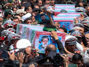Supporting image for story: Iran buries late president at holy Shiite site after fatal helicopter crash