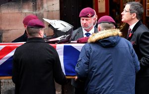 The military funeral of Northern Ireland veteran Luke Smith, at St Michael's and All Angels Church, Penkridge.Luke's motorcross helmet and beret on top of his coffin.