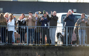A crowd cheers on Lauren Powell