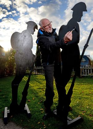 Robert Bradley paints one of the soldiers