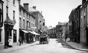 High Street, Wem. Shops include Mortons on the left, and Jarvis Ironmongers on the right. This postcard was franked on September 11, 1922. From the collection of Ray Farlow.