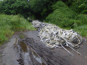 Supporting image for story: Flytippers dump huge pile of metal and plastic strips on footpath near Newport