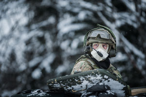 Soldier gazing from the turret of an Warrior vehicle wearing his cold weather mask.
Photo: Corporal Sam Jenkins