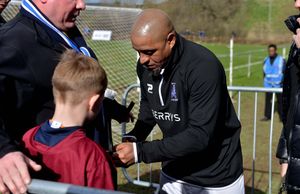 Roberto Carlos gives an autograph for Callum Hardy, 7, from Shrewsbury 