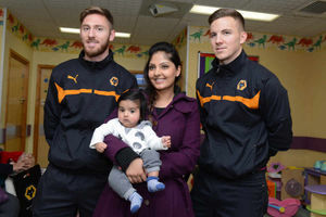 From left is James Henry, Akaal Multani, 4 months, Ambi Multani, and Lee Evans on the Children's Ward