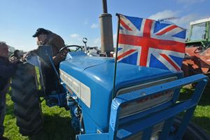 The Union Jack was flapping in the wind ahead atop this blue tractor