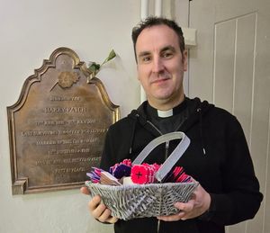 Supporting image for story: Poppies on display in the Shropshire village church where the last surviving British Tommy of World War One was wed