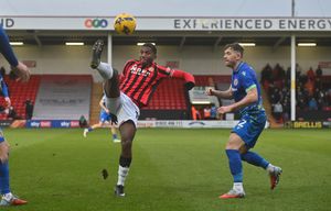 Daniel Kanu challenges for the ball.