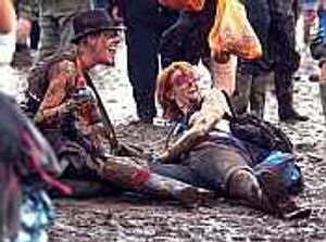 Supporting image for story: Rain lashes festival-goers