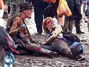 Supporting image for story: Rain lashes festival-goers