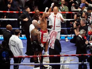 Chris Eubank Jr raises his arms in celebration of his victory