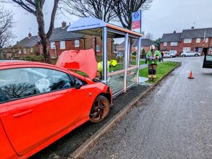 Supporting image for story: 'Driver flees' after wrecking bus stop in crash 