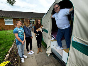 Supporting image for story: Pensioner moves into TENT in his front garden to make way for his teenage children