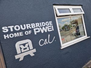 The artwork of Pop WIll Eat Itself on the building at Foster Street, Stourbridge 