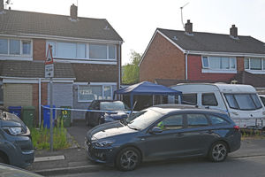 Police at the scene after the bodies were found