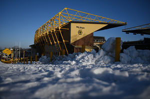 The match went ahead despite snowy conditions outside the ground (Photo by Shaun Botterill/Getty Images)