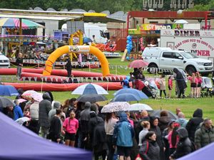 Supporting image for story: In pictures: Willenhall Carnival branded a success as 1,500 people brave the elements to enjoy funfair, dog competition and other attractions