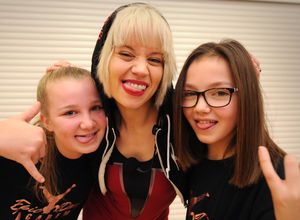 Kimberly Wyatt, during her visit to lead a dance class, at Haden Hill Leisure Centre, Cradley Heath, meeting (left) Emily Bowdler, 11, of Pelsall, and (right) Libby Mae, 11, of Pelsal