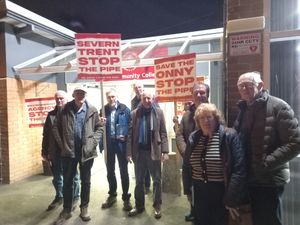 Campaigners stood outside The Community College, Bishop\'s Castle, protesting against plans to build a pipeline that would transfer wastewater from the town to the River Onny. Picture: LDRS
