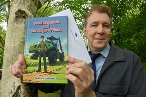 Shropshire author, Dr Tadzio Jadlowski, with his new children's book 'Jonni Greenbelt and The Magic of Fields'