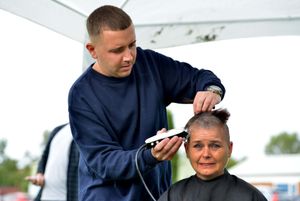 Ryan Teer from The Salon in Aldridge goes to work shaving off Donna's hair