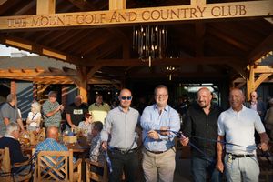 Mike Wood cuts the ribbon at the Mount Golf and Country Club: (L-R) (Left to Right) Brett Bernard, Mike Wood MP, Scott Bernard and Roy Bernard 