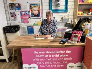 Marg loves working on the till in the Bridgnorth charity shop. Photo: Hope House