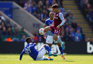 Leicester City's Patson Daka tackles Aston Villa's Philippe Coutinho