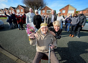 Eric with granddaughter Jo and other family and neighbours who came out of their houses to join in with the celebrations