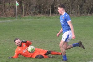 Llandrindod Wells' Ruben Edwards rounds advancing Radnor Valley goalkeeper Adam Jones and tucks the ball into an unguarded net (Picture: Stuart Townsend)