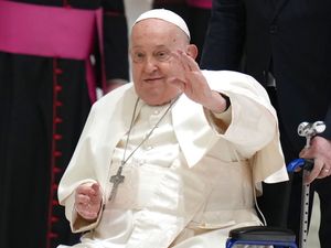 The pope waves