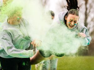 Supporting image for story: Colour explosion as school's pupils get messy with paint on Red Nose Day
