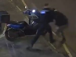 PC Walsh tackling one of the suspects. Image: West Midlands Police