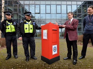 Supporting image for story: Creative students work on police project