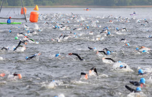 Athletes in the water during the swimming stage of the triathlon
